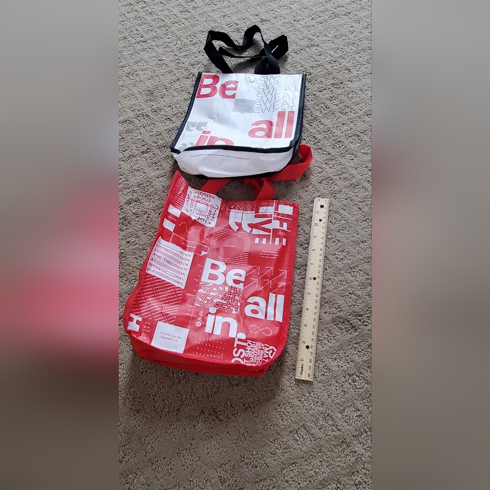 2 lululemon shopping bags. Used to bring product home.